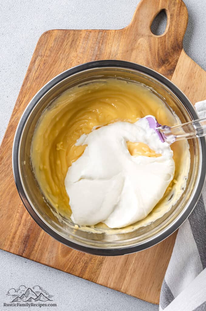 Mixing whipped cream into the pastry cream