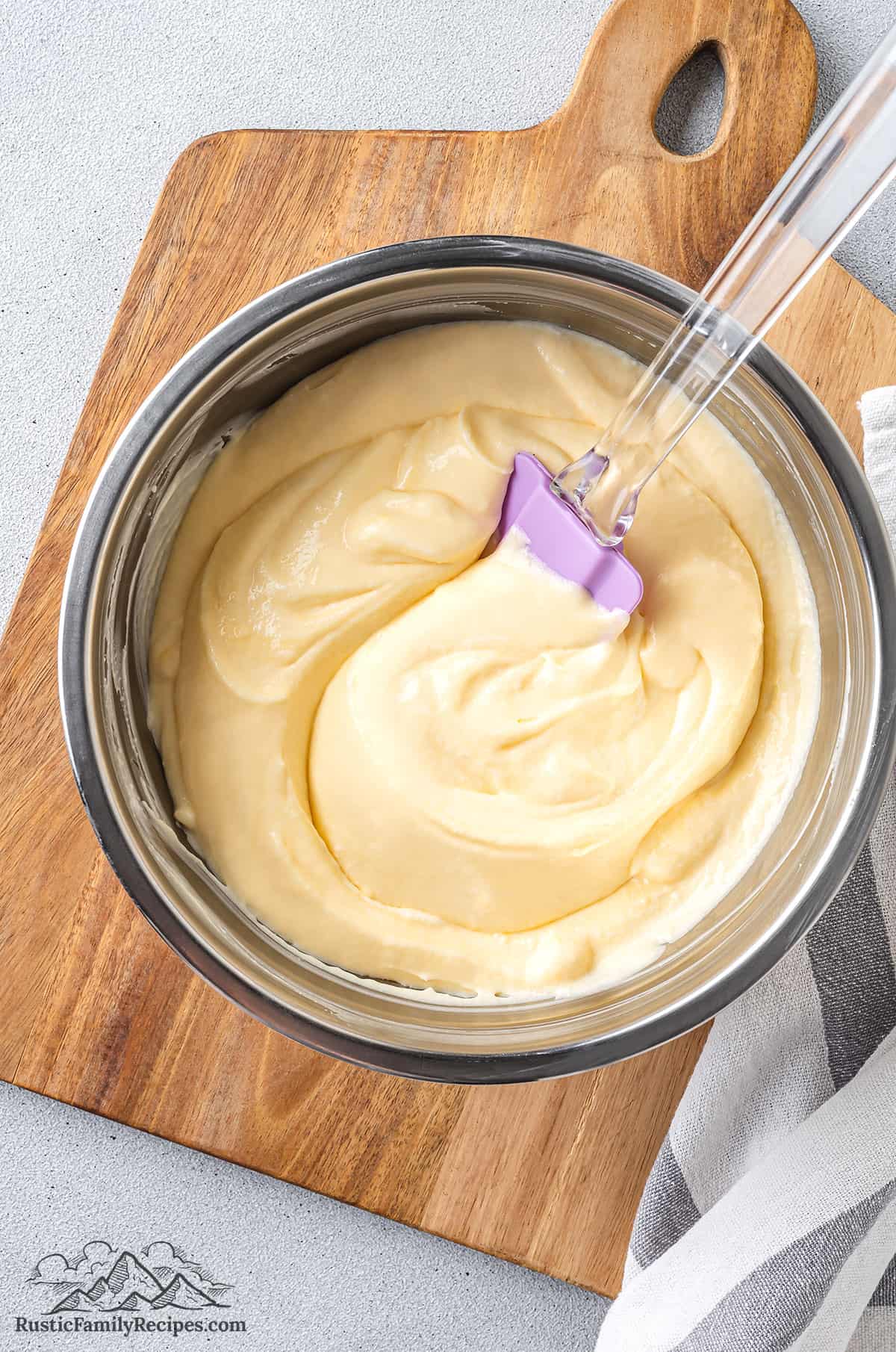 Diplomat cream in a bowl with a spatula