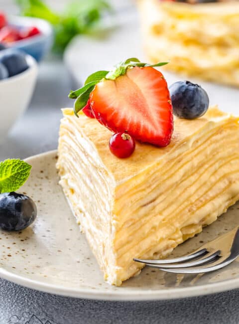 Close up of a slice of Crepe Cake on a plate