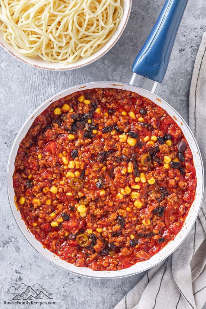 Mexican Spaghetti sauce with black beans and corn in a skillet