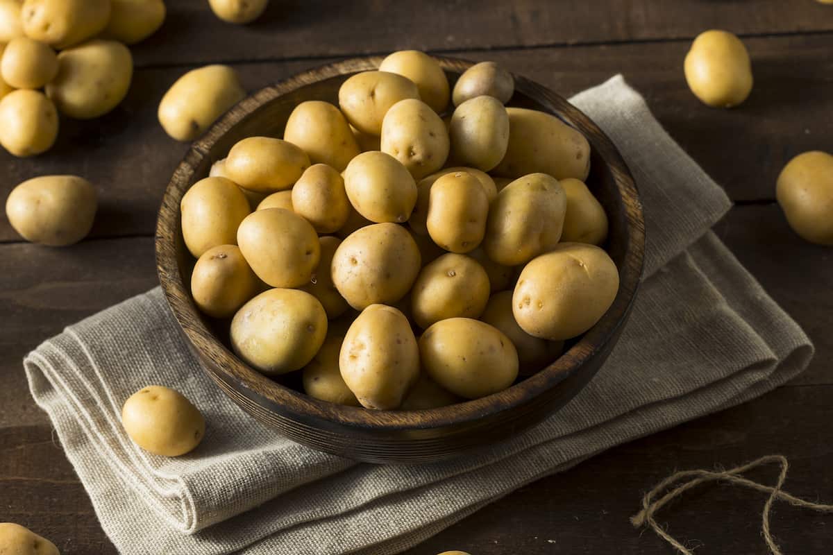 Yukon gold potatoes in a rustic basket