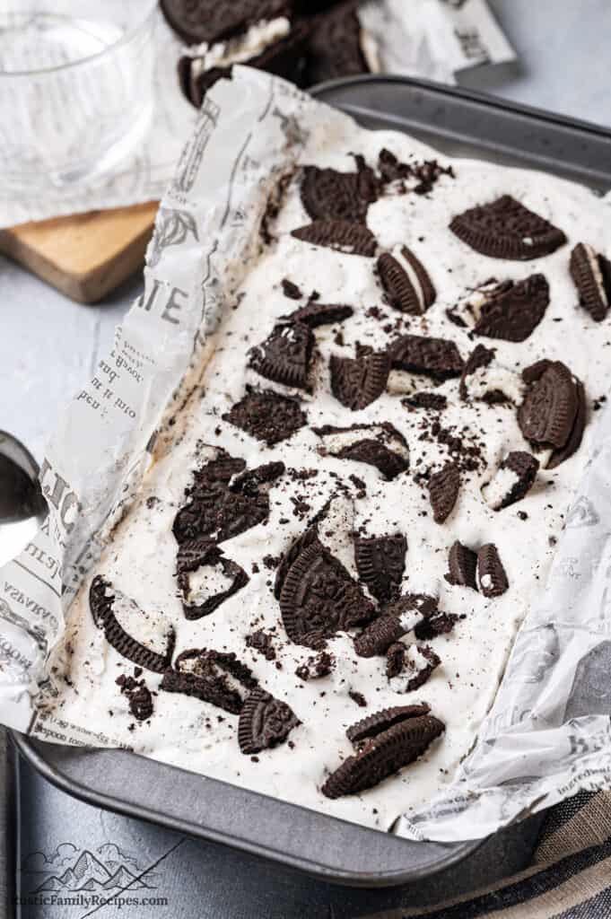 Oreo ice cream in a loaf pan ready to freeze
