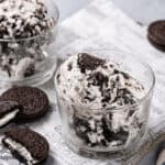 Small glass cups with Oreo ice cream in them.