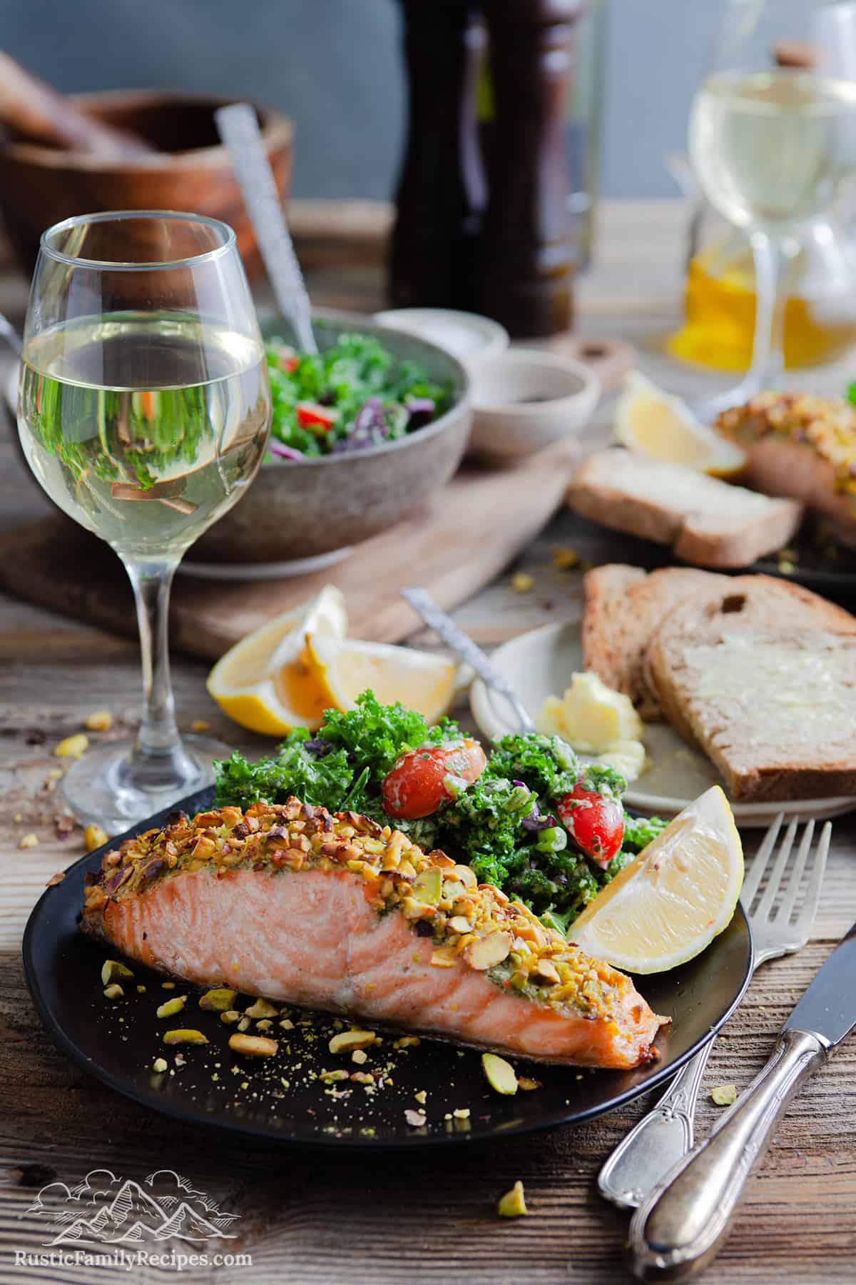 Pistachio crusted salmon on a plate with salad