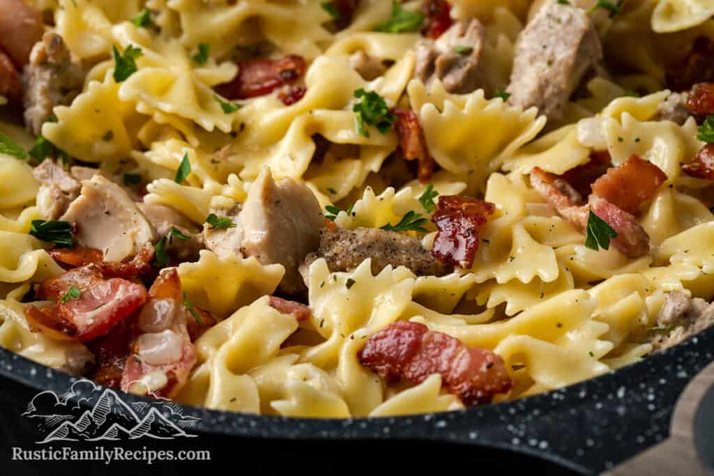 Close up of chicken bacon ranch pasta in a skillet