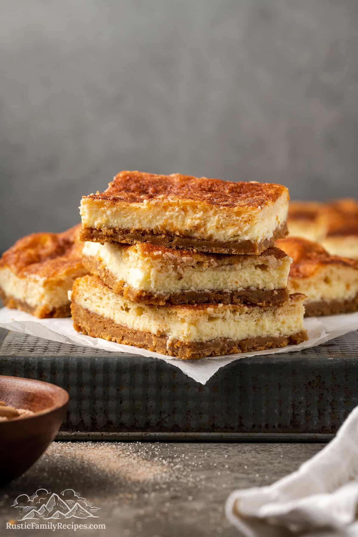 A stack of churro cheesecake slices