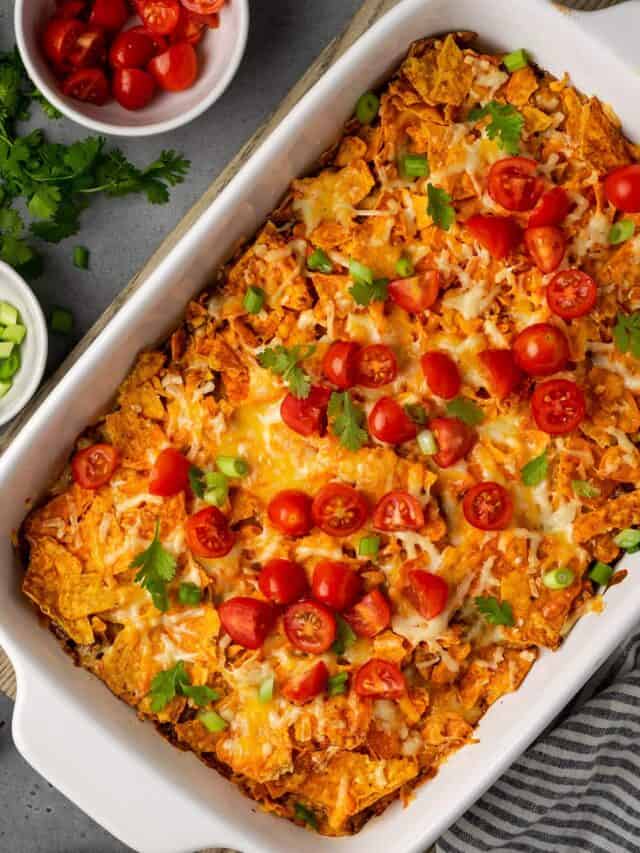 A dorito casserole in a white baking dish