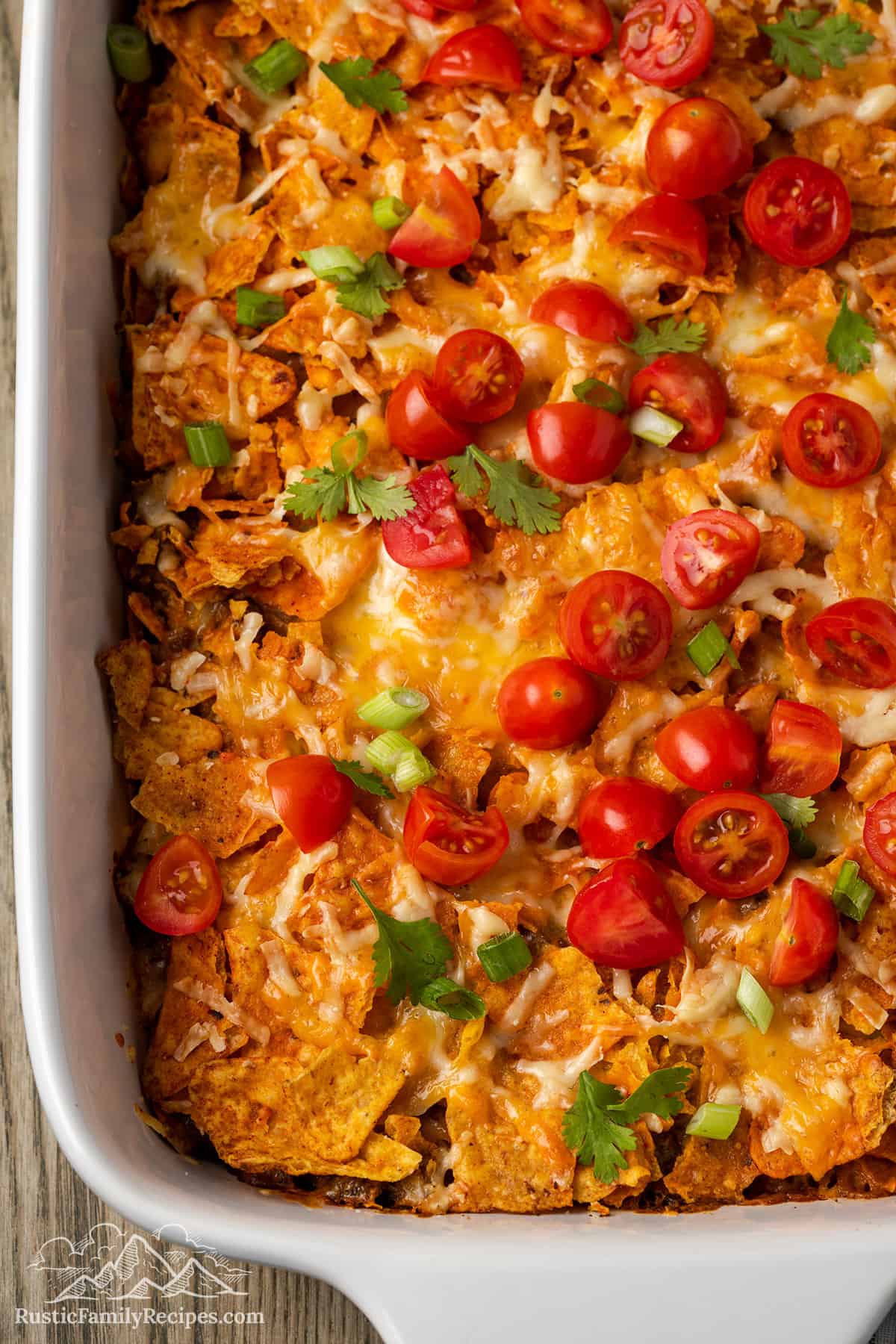 Dorito Casserole with taco toppings in a baking dish