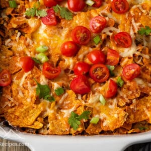Dorito Casserole with taco toppings in a baking dish