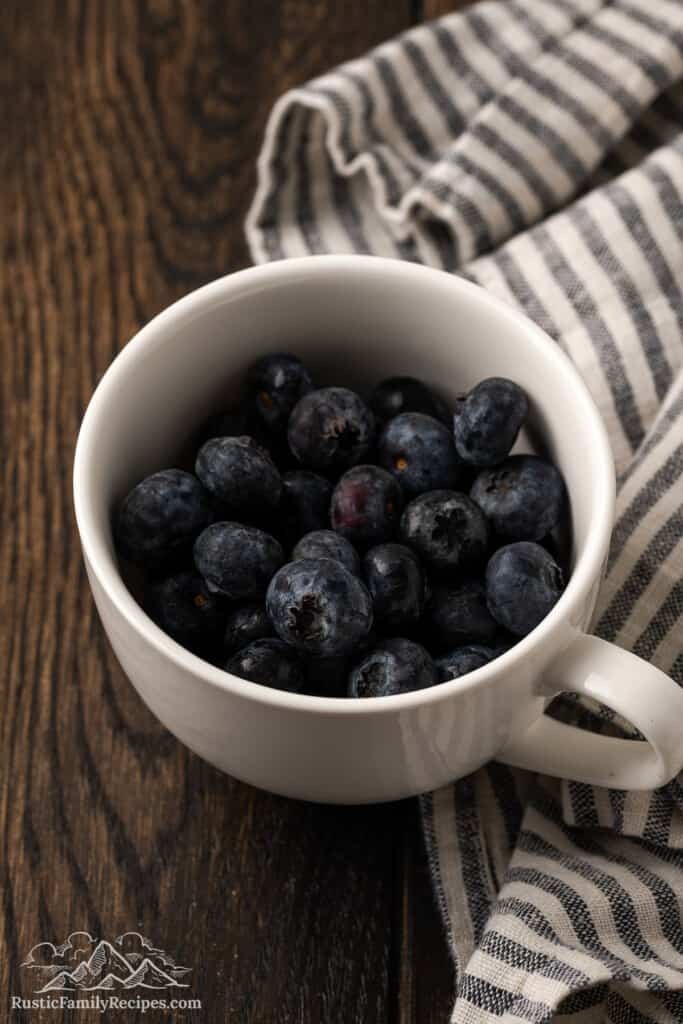 Fresh blueberries in a mug