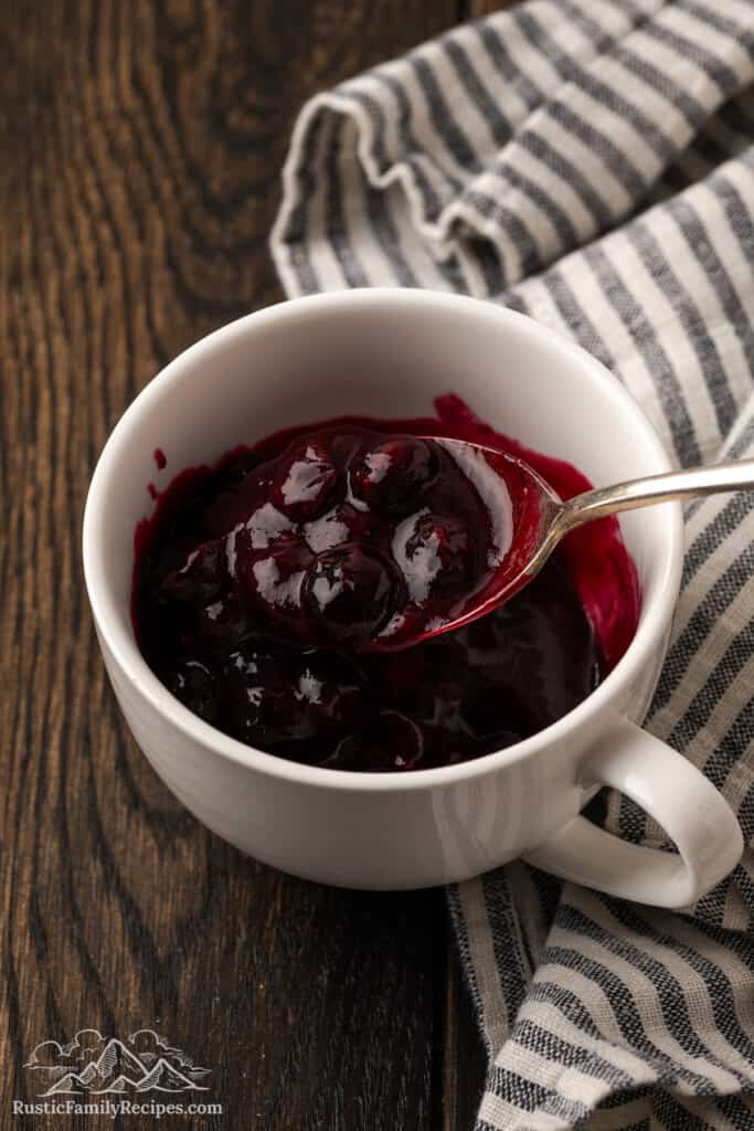 Cooked blueberries in a mug