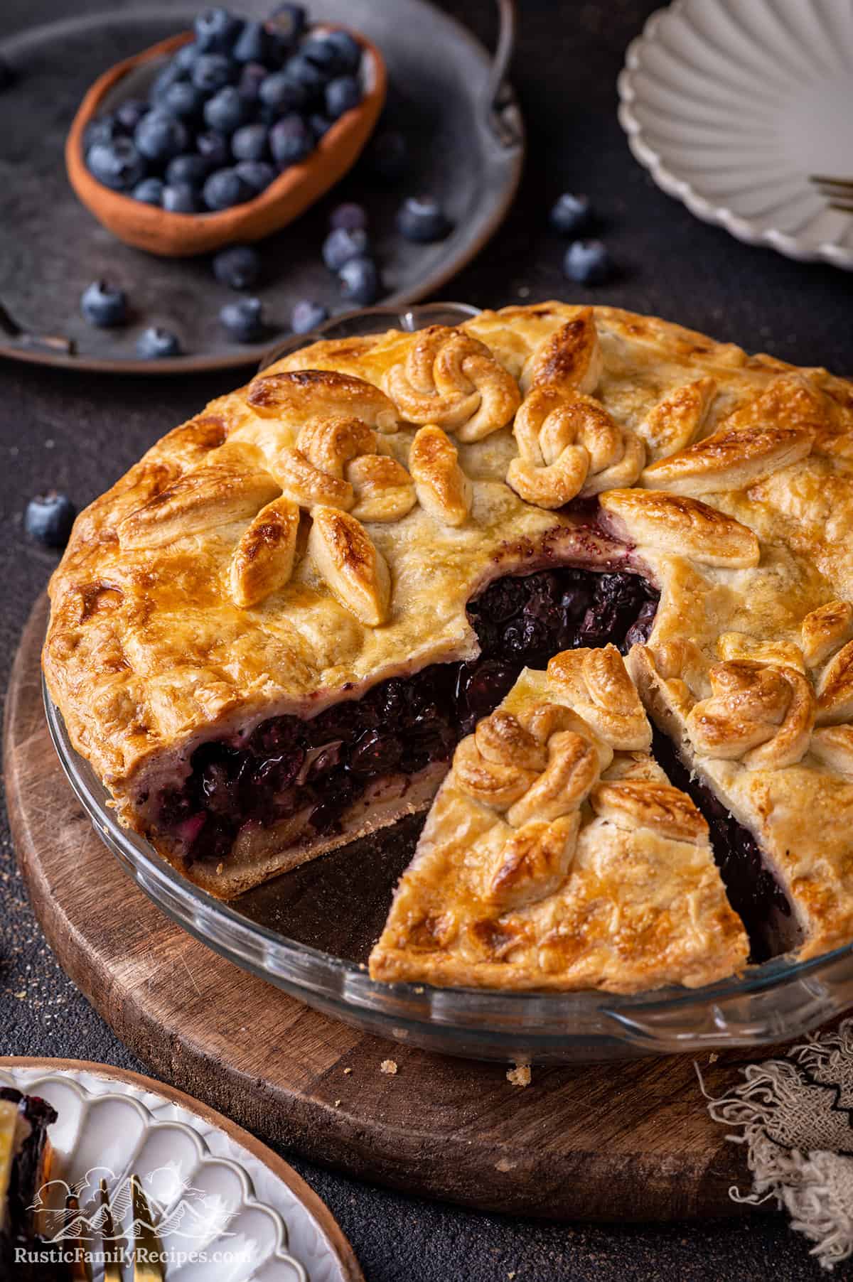 Homemade blueberry pie with a slice taken out