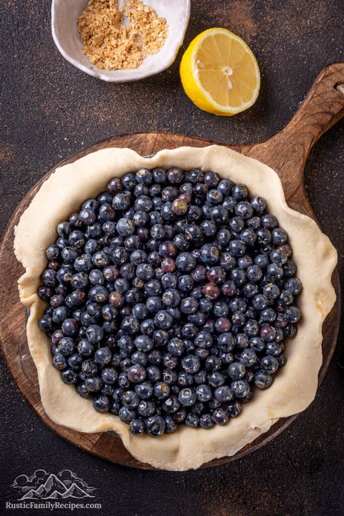 Blueberry pie ready for the top dough 