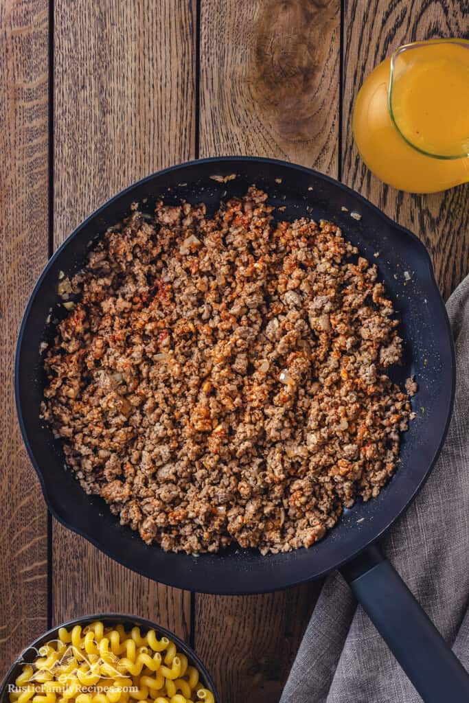 Seasoned ground beef in a cast iron skillet.