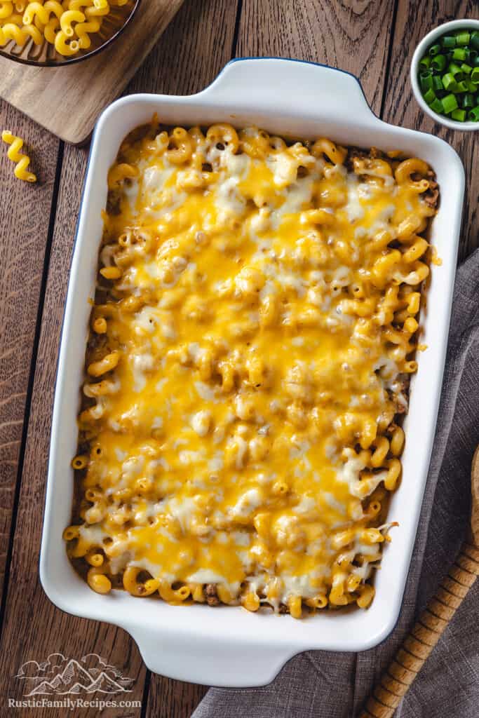 Overhead view of baked cheeseburger casserole in a 9x13 casserole dish.