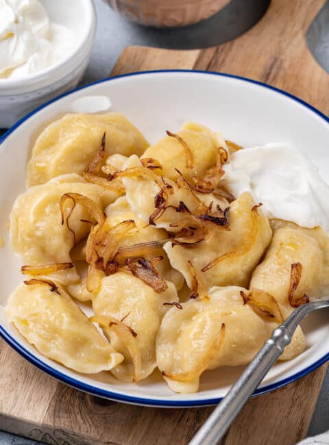 A white plate filled with Potato Pierogis