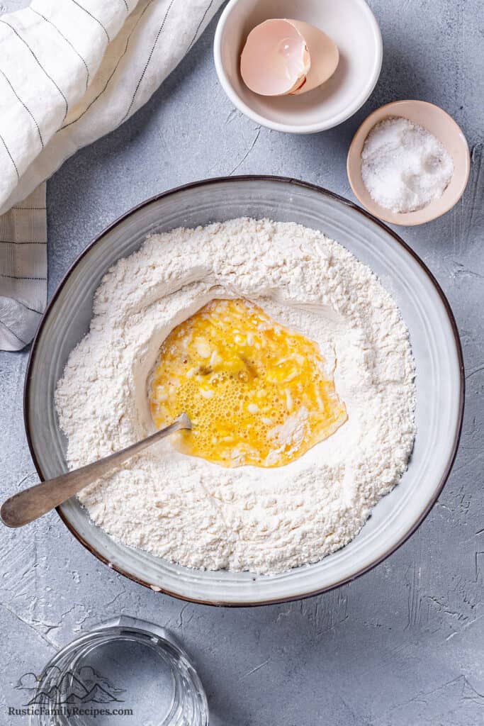 Mixing flour and egg with a fork