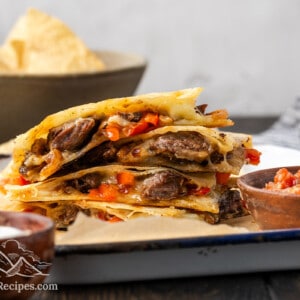 Close up of a stack of steak quesadilla pieces