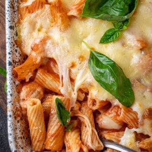Top view close up of baked ziti in a baking dish