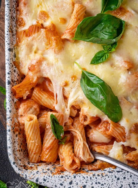 Top view close up of baked ziti in a baking dish