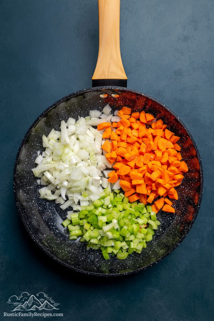 Chopped onion, celery and carrots ready to cook.