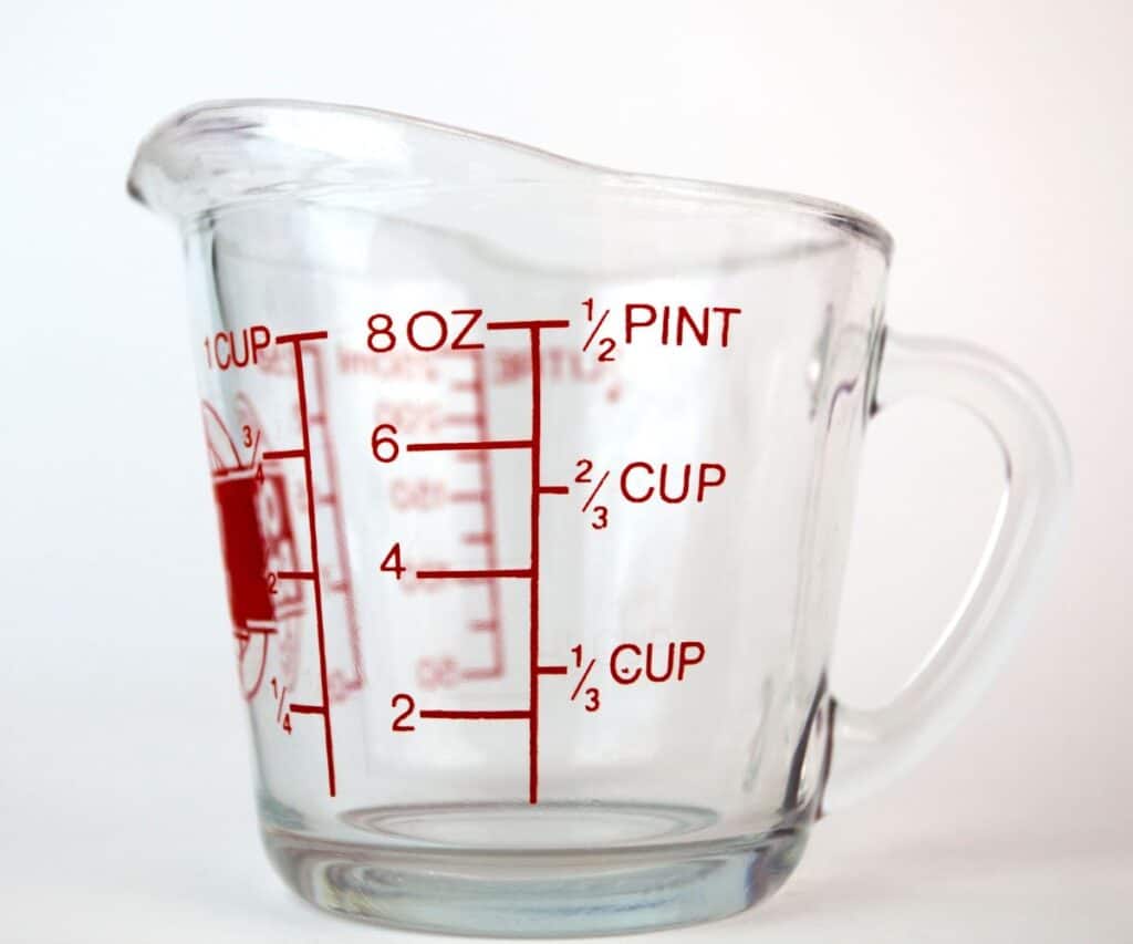 A measuring cup with ounces and cups